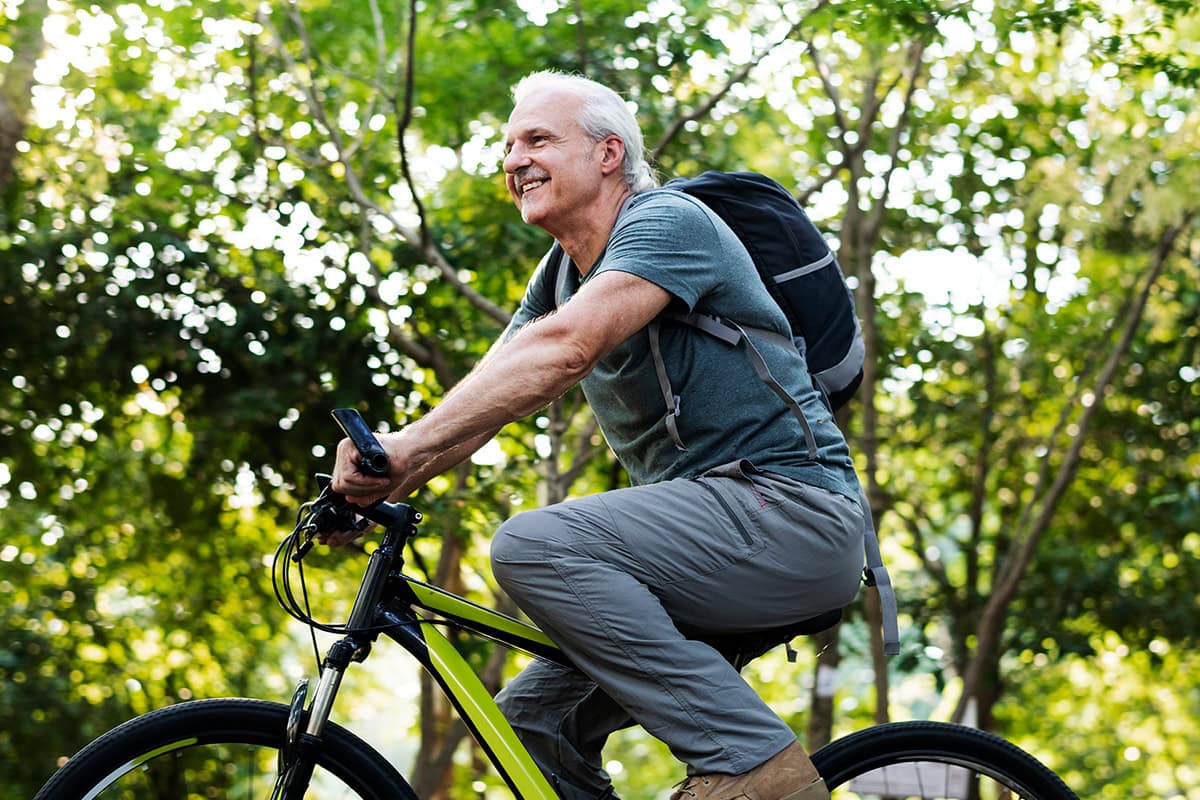 Senior Man Biking in the Park